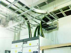 Cable trays and busduct riser above a switchboard